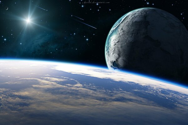 El planeta y su satélite en el fondo de los cometas que caen