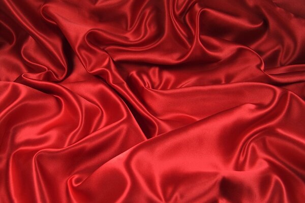 Smooth shiny red fabric, pleats and curves