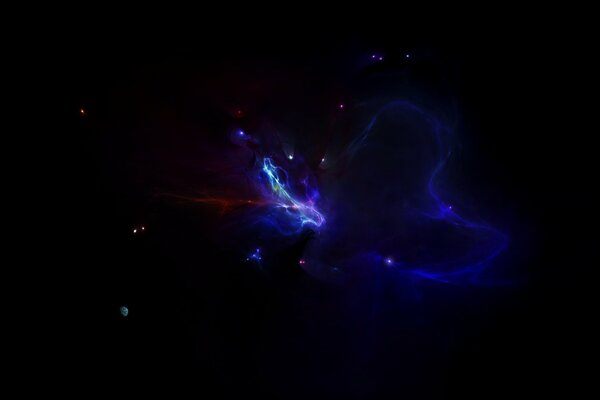 A dark nebula with a small glow of stars