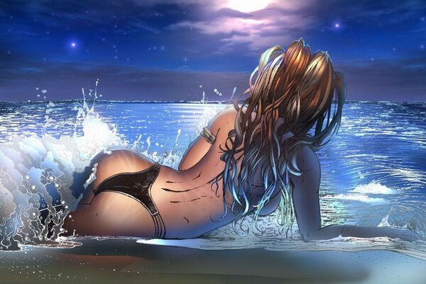 Girl on the beach in the sea waves