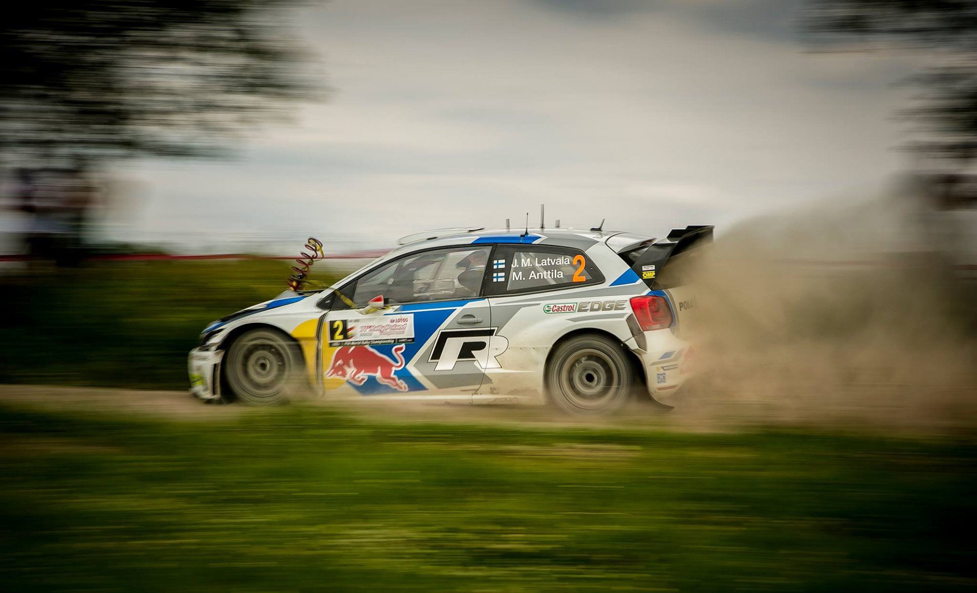 volkswagen volkswagen polo wrc jari-matti latvala spring grass gravel dust