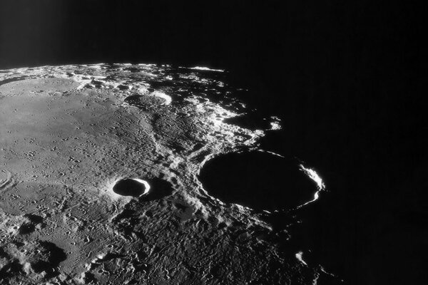 The shadow of a crater on the moon in the Terminator
