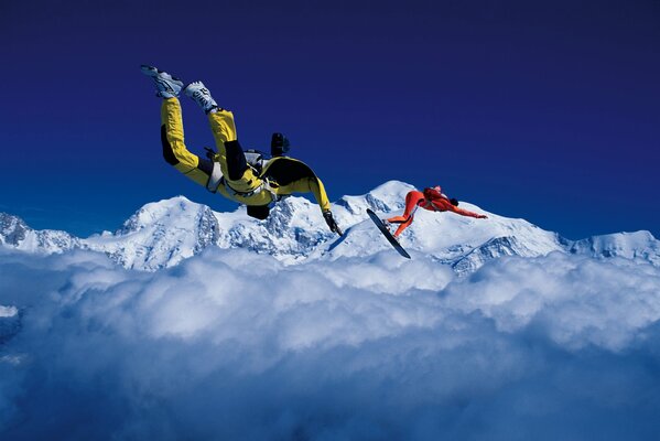 Extreme sky surfing on a board above the clouds