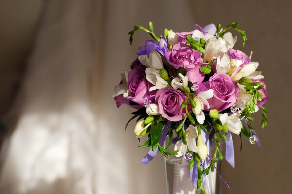 Purple, pink and white flowers in a vase