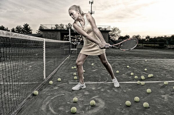 The girl athlete scores the ball