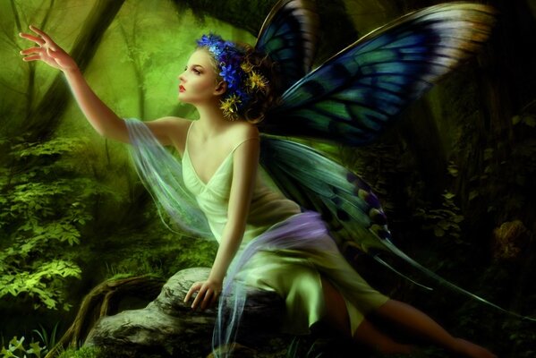 A beautiful fairy girl in the form of a butterfly sits on a stone and stretches her hand