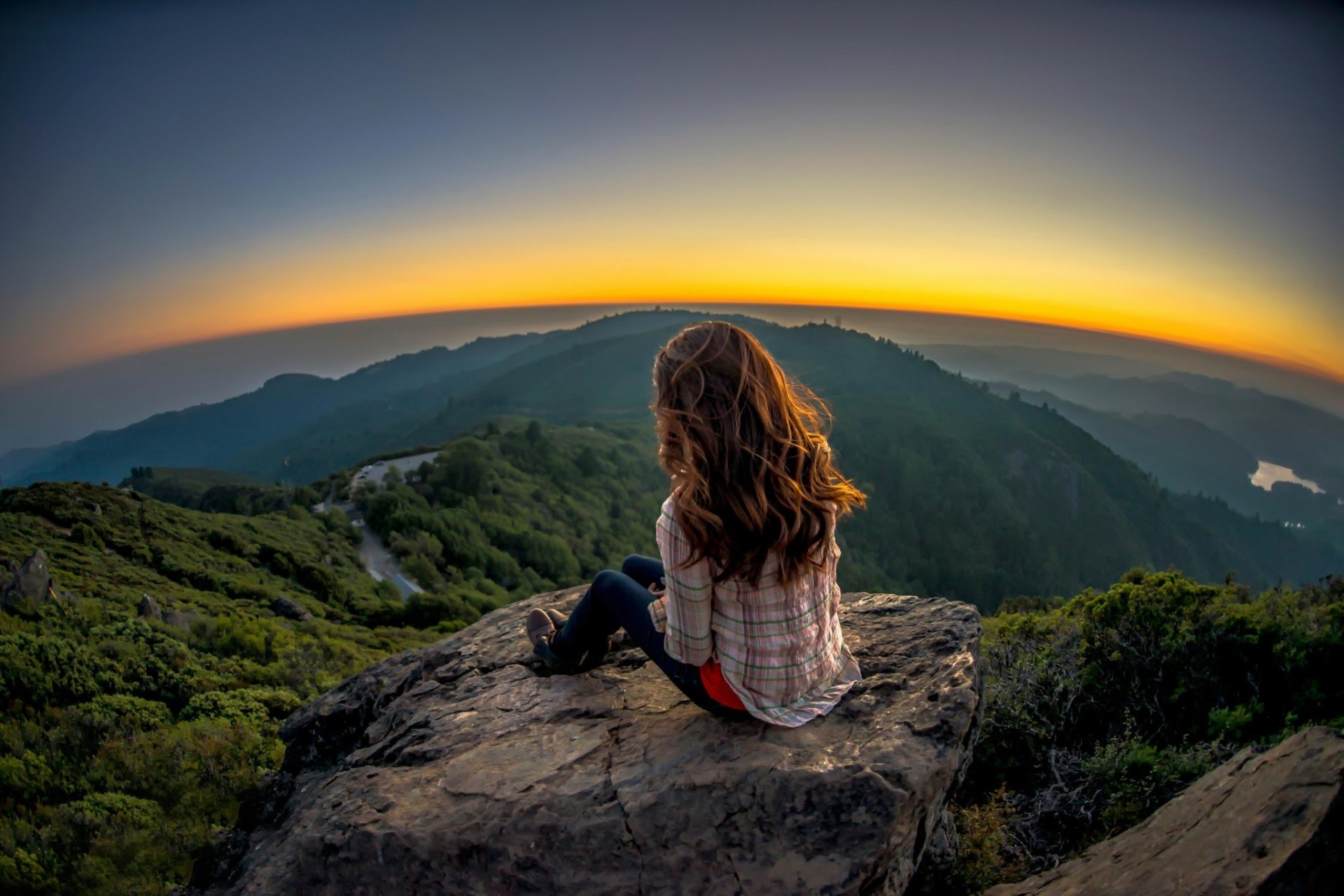 landscape girl views cool stone on a rock