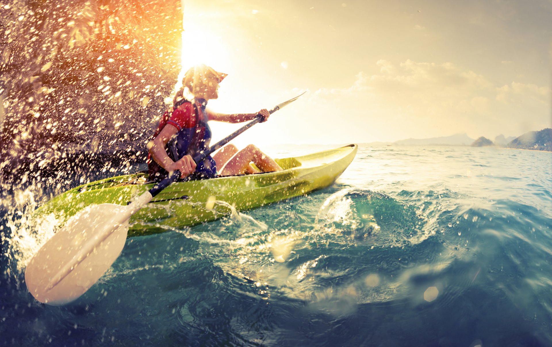 kayak rowing water sun