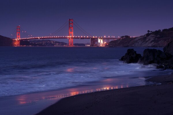 A glowing bridge on the river. Landscape