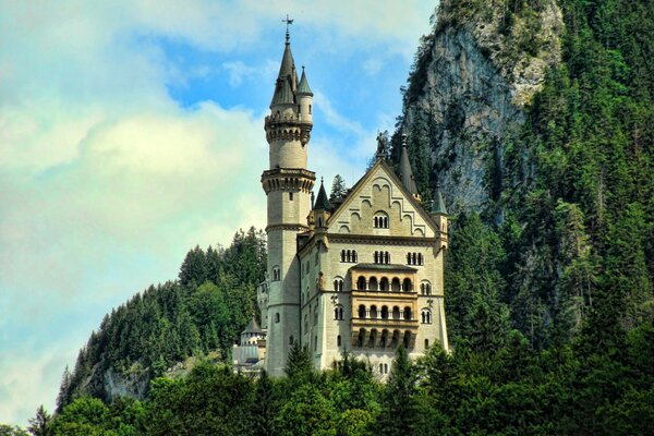 A palace with towers on a cliff near the rocks