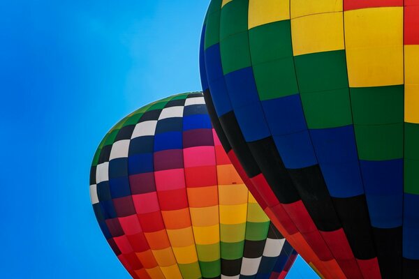 Bright balloons on a clear sky background