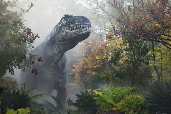 Dinasaurus in the misty autumn forest