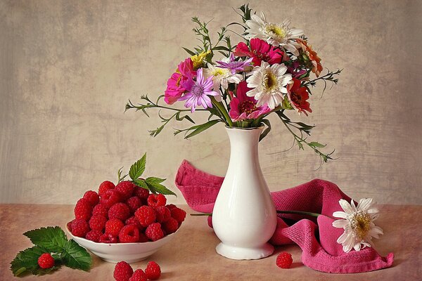 Summer still life with flowers and raspberries