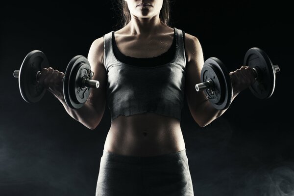 Fitness exercise woman with dumbbells