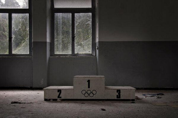 An abandoned gym with a pedestal