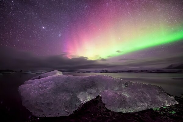 Reflection of an ice floe in the Northern lights