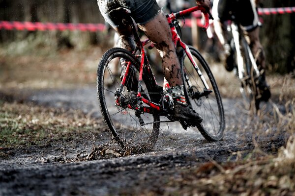 Cyclists riding on a muddy track