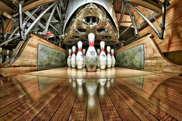 Bowling pins are reflected on the floor