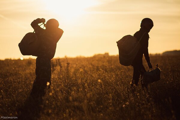 Two at sunset in a field