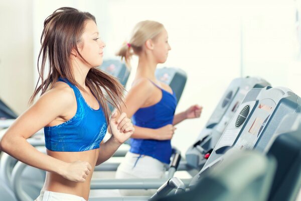 Female athletes on treadmills