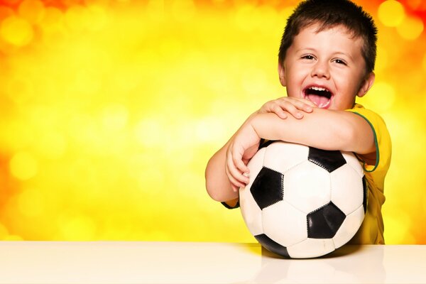 A young fan with a soccer ball