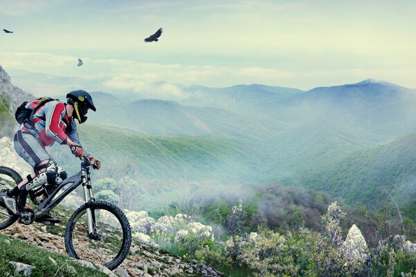 A man in a helmet on a bicycle in the mountains