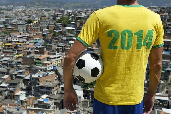 A football fan in a T-shirt with the inscription 2014