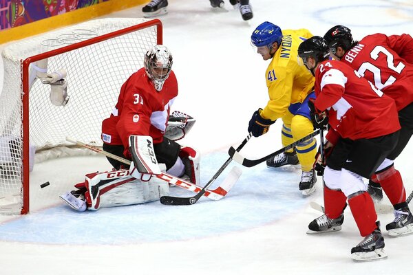 Eishockeyspieler mit Puck, olympische Spiele