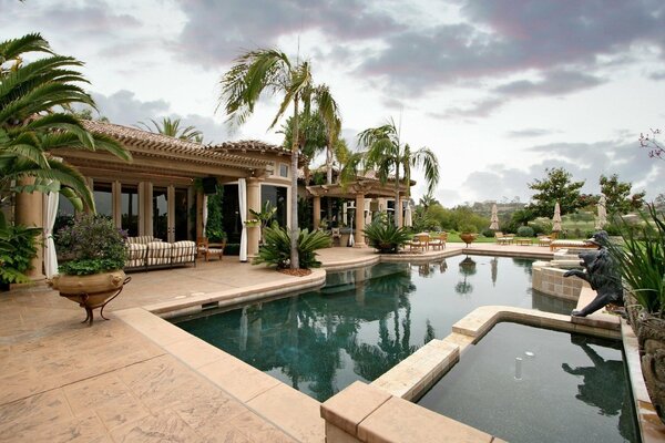 Luxury mansion with swimming pool and palm trees