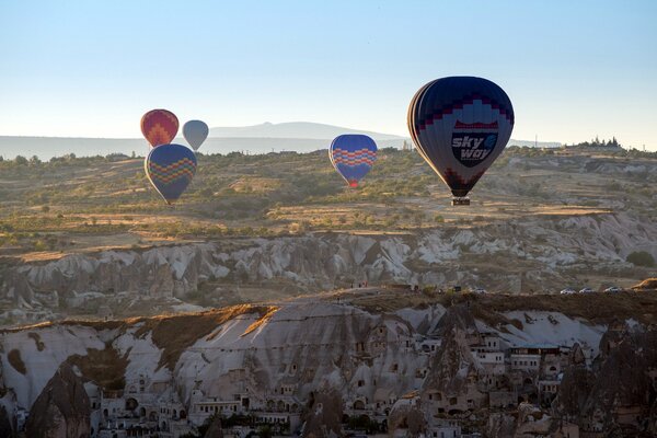 Balloon in flight in the mountains