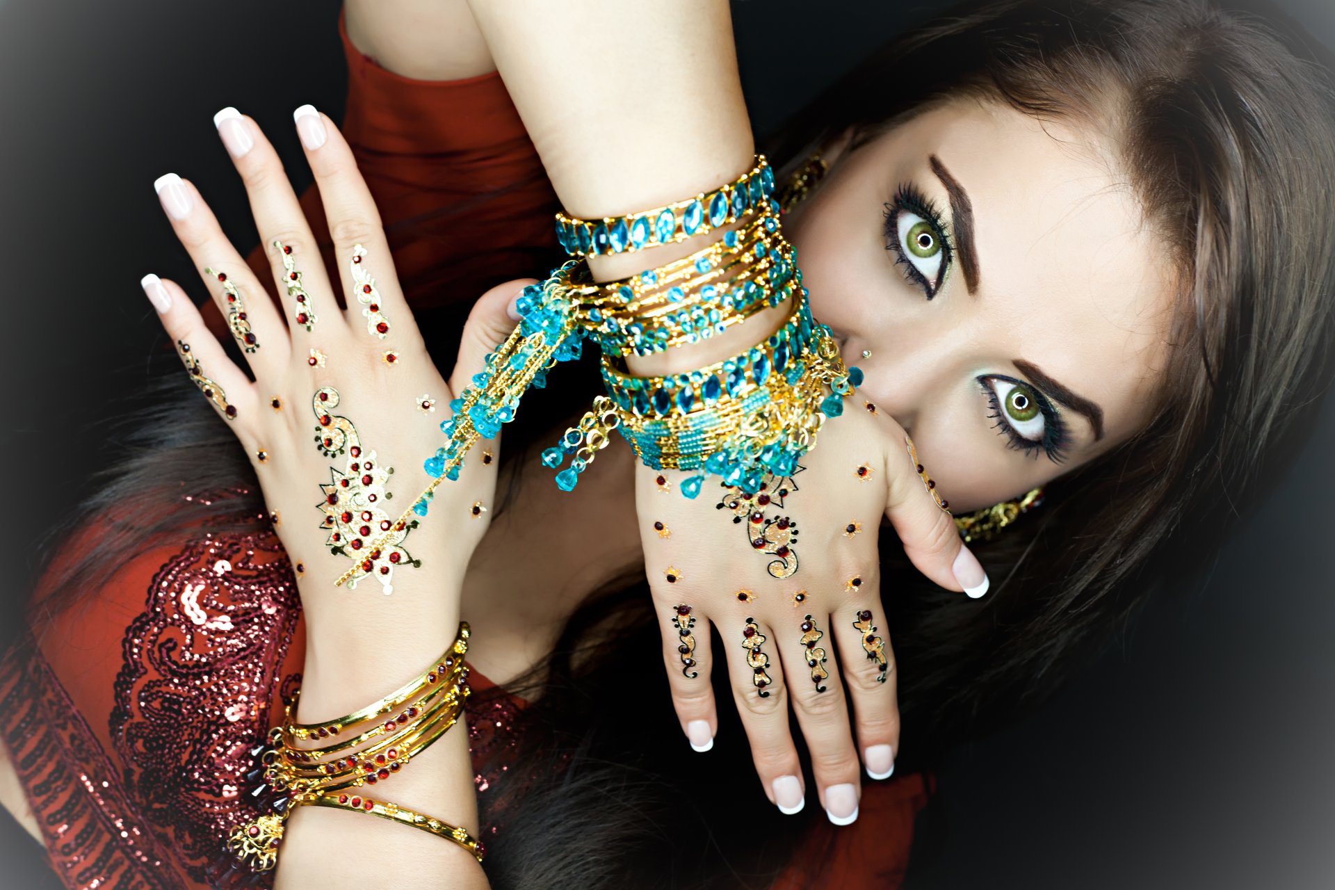 girl . view green eyes make-up hair hands decoration bracelets stones indian