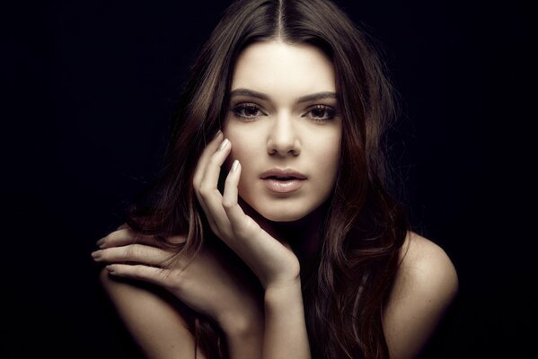 Model Kendall Jenner on a black background