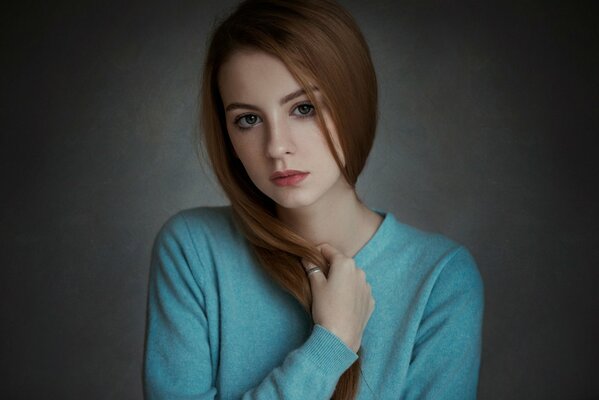 Photo of a beautiful red-haired girl with freckles