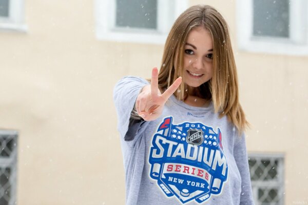 Blonde under the snow and a T-shirt