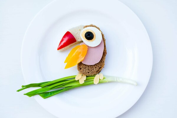 Children s breakfast of eggs and bread in the form of a bird