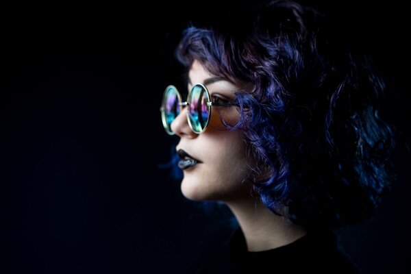 A girl on a black background with unusual hair