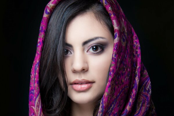 Indian girl in a beautiful bright scarf