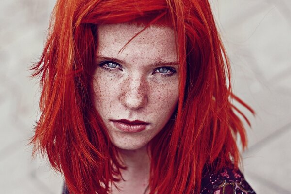 A girl with red hair and freckles