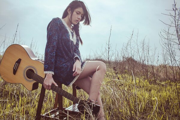 Cute asian girl with guitar