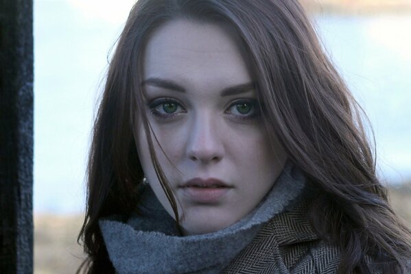 Cute girl with green eyes on the street