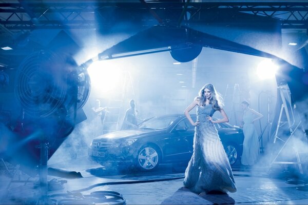 German model Julia Stegner on the background of a Mercedes car