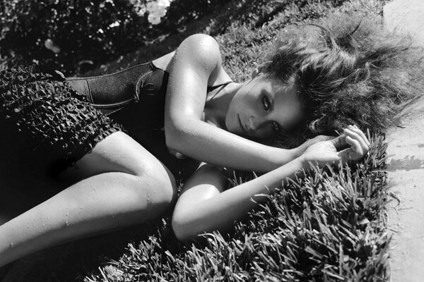 Black and white photo of a girl near the road