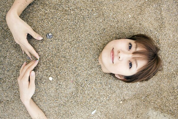 Beautiful Japanese woman in the sand