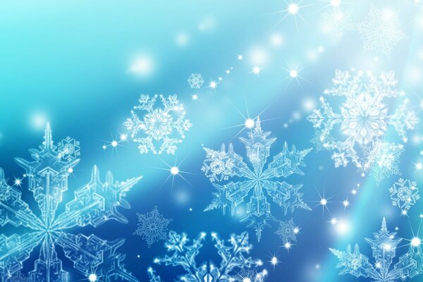 Koronkowe płatki śniegu na niebieskim tle