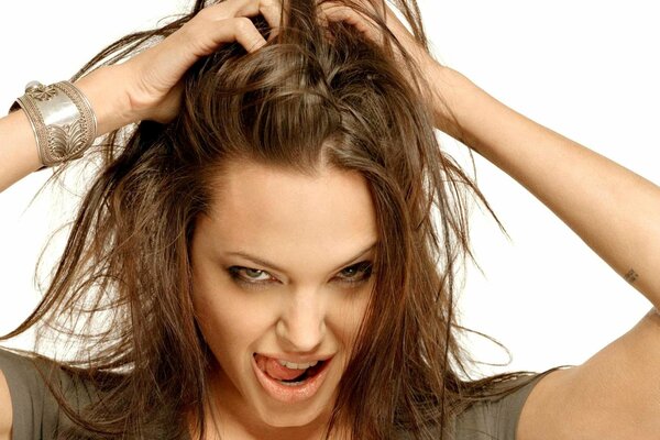 Angelina Jolie with shaggy hair and a cheeky look