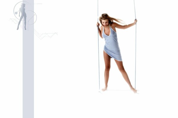 Girl on a swing on a white background