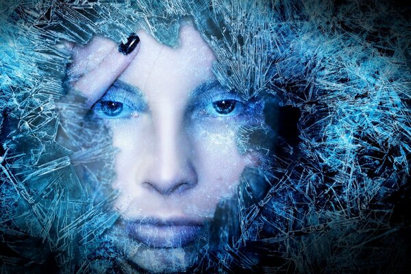 The girl s face under the blue ice