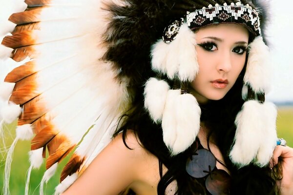 A girl in feathers and with fur