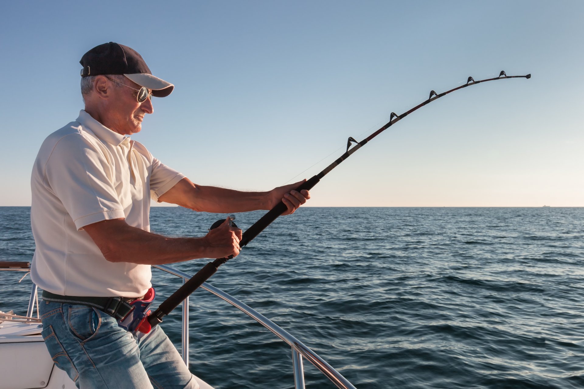 deep sea fishing man fight strength boat