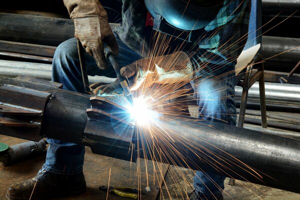 The work of a welder at a metallurgical plant